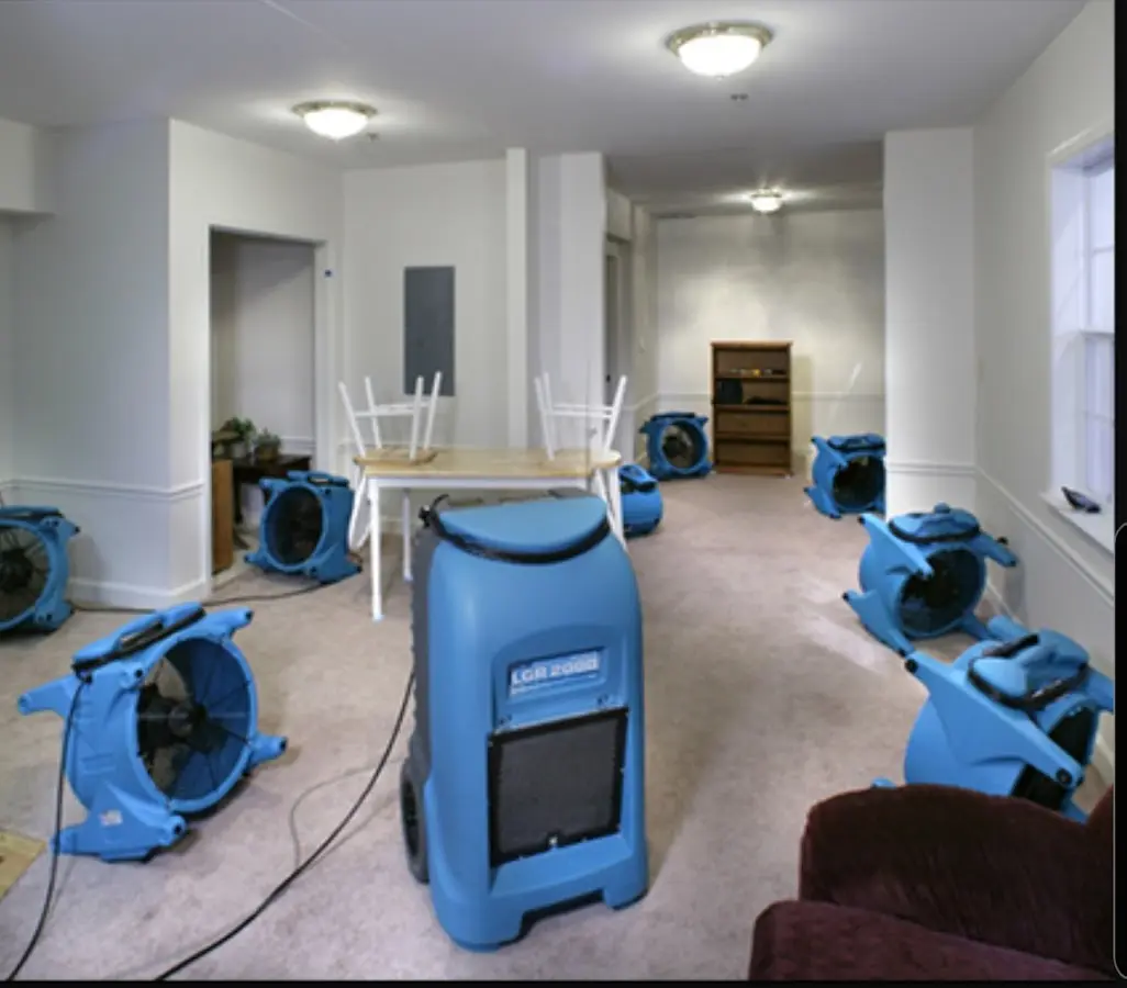 Air movers and dehumidifier setup for Water Damage Restoration in Rockingham