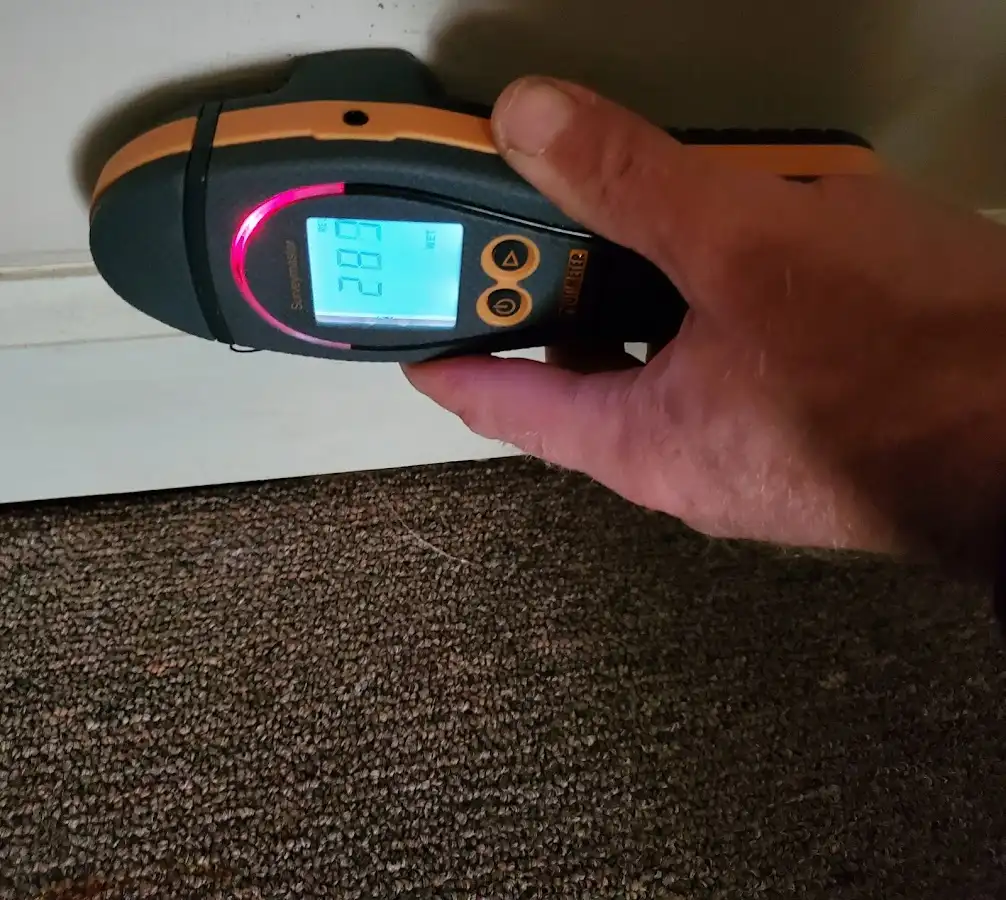 Moisture detection at baseboard during Storm Damage Restoration in Rockingham